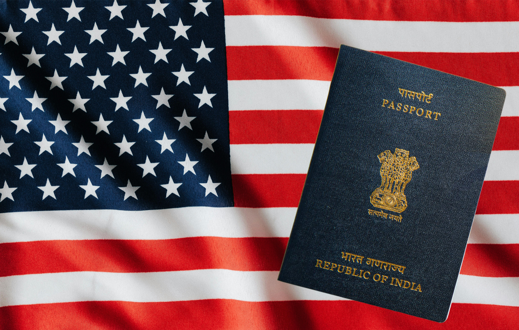 An official US Embassy seal displayed on a digital screen with the text "Visa Advisory 2026" and a silhouette of a traveler holding a passport.