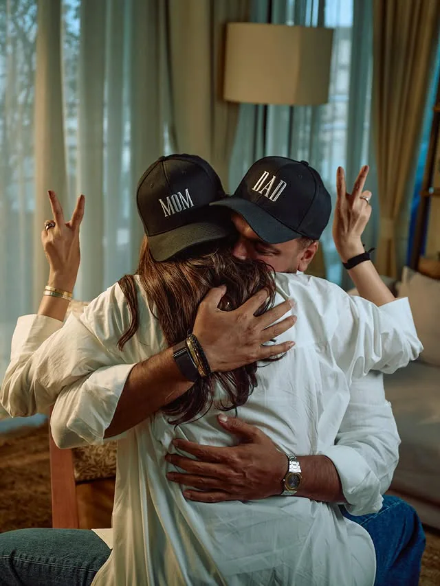 Karishma Tanna and Varun Bangera wearing matching 'Mom' and 'Dad' baseball caps for their pregnancy announcement photoshoot.