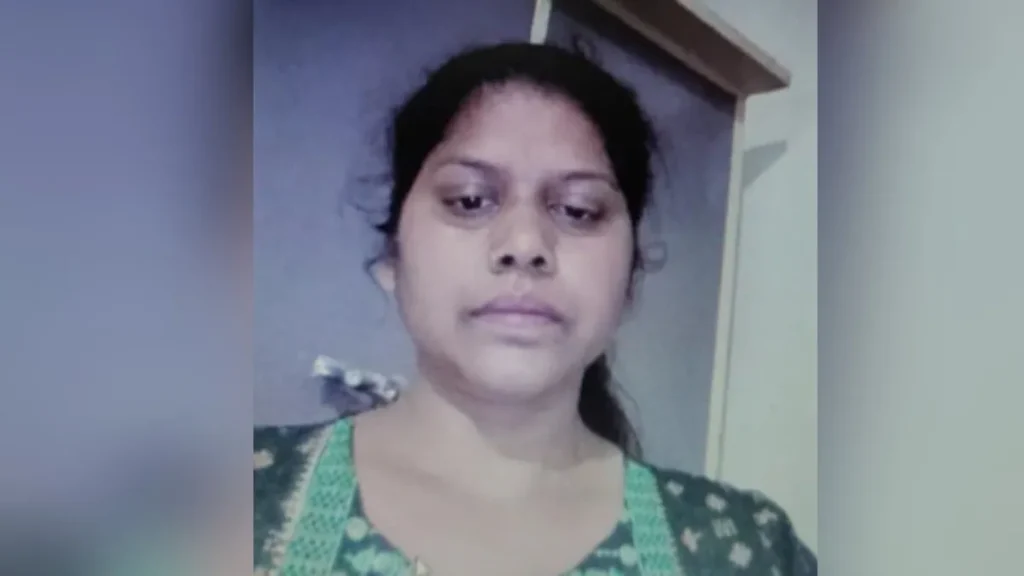A close-up front-facing photograph of Babita Dhakad, alias Khadija, looking toward the camera, wearing a green patterned traditional Indian outfit.