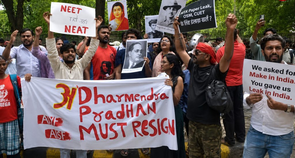 A dense crowd of students and citizens holding banners demanding educational reform and the resignation of Education Minister Dharmendra Pradhan during a Cockroach Janta Party (CJP) demonstration at Jantar Mantar, New Delhi.